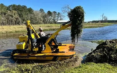 Aquatic vegetation removal workboat clearing waterway growth